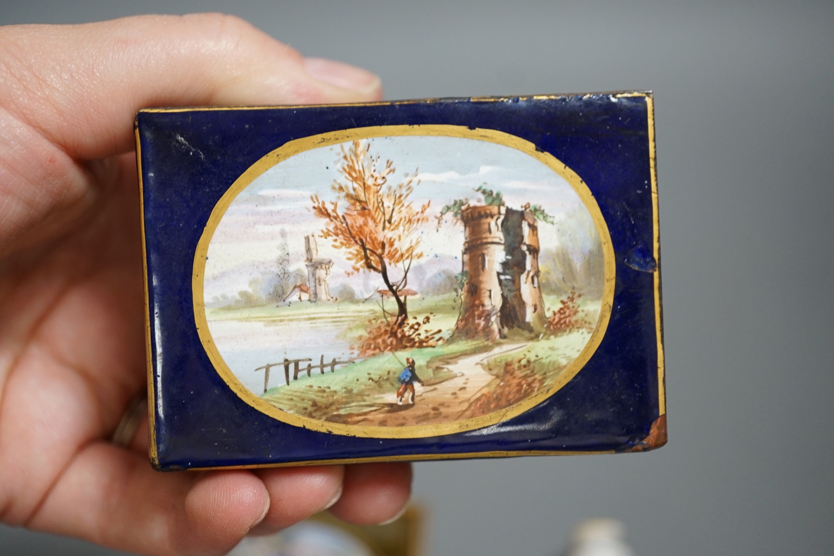 A Continental circular porcelain pot and cover, a plaque and a matchbox cover